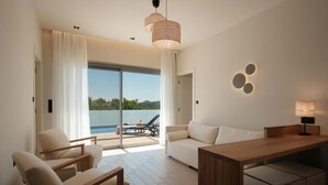 A modern living room with a wooden coffee table, two white sofas, and a large window overlooking a pool and greenery. - VILA1 ANAPNOE IKIES CORFU WITH PRIVATE POOL (Corfu)