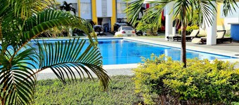 8 minutes from the beach! Family apartment with pool & gardens in private gated community