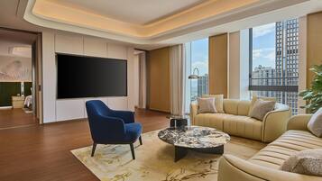 Basic Room, 1 King Bed | Living area | 65-inch LCD TV with cable channels