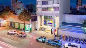 A modern hotel building with a prominent 'tru by Hilton' sign, featuring a unique facade with colorful window blocks and a flat roof. - Tru By Hilton Da Nang City Centre (Da Nang)