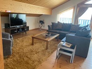 Smart TV, DVD player, foosball, books