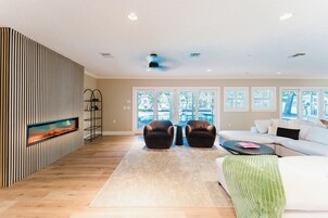 Deluxe Villa, 5 Bedrooms, Garden View | Living area | 55-inch Smart TV with cable channels, fireplace, Netflix