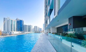Outdoor pool - Canal View Luxury Pool Access & Hot Tub (Dubai)