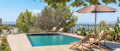 Outdoor pool, pool umbrellas, pool loungers