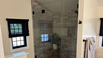 Shower, hair dryer, towels, soap