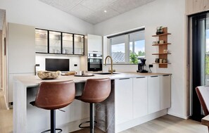 Fridge, dishwasher, coffee/tea maker, cookware/dishes/utensils