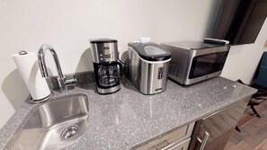 Fridge, microwave, coffee/tea maker, toaster