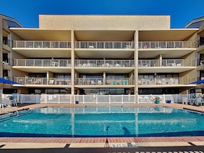 A multi-story hotel with a swimming pool. - Laguna Reef Getaway Unit 106 (Rockport)