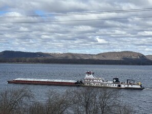 A river with a barge and a tugboat.
