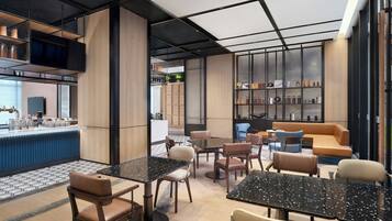 A modern interior with seating areas, a bar, and shelves with items.