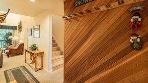A staircase with a wooden finish and a sign reading 'SNOWBOUND'. - Snowbound at Snow Flower — 2 Bedrooms + Loft, Heated Pool, Hot Tub & Fitness! (Park City)