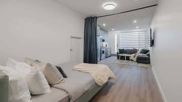 1 bedroom, desk, iron/ironing board, travel crib