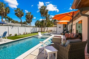 A heated pool - Fancy That: Pool, Putting Green, 1.5 Blocks to Beach by Anna Maria Life Vacation Rentals (Holmes Beach)
