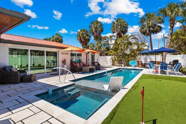 A heated pool - Fancy That: Pool, Putting Green, 1.5 Blocks to Beach by Anna Maria Life Vacation Rentals (Holmes Beach)