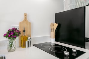 Fridge, microwave, coffee/tea maker, cookware/dishes/utensils