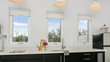 Fridge, microwave, coffee/tea maker, cookware/dishes/utensils