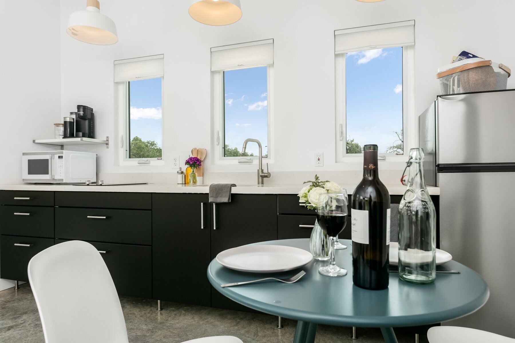 Fridge, microwave, coffee/tea maker, cookware/dishes/utensils