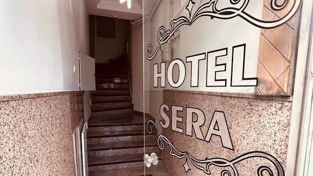 A hotel entrance with a staircase leading to a landing. - Sera Hotel (Istanbul)