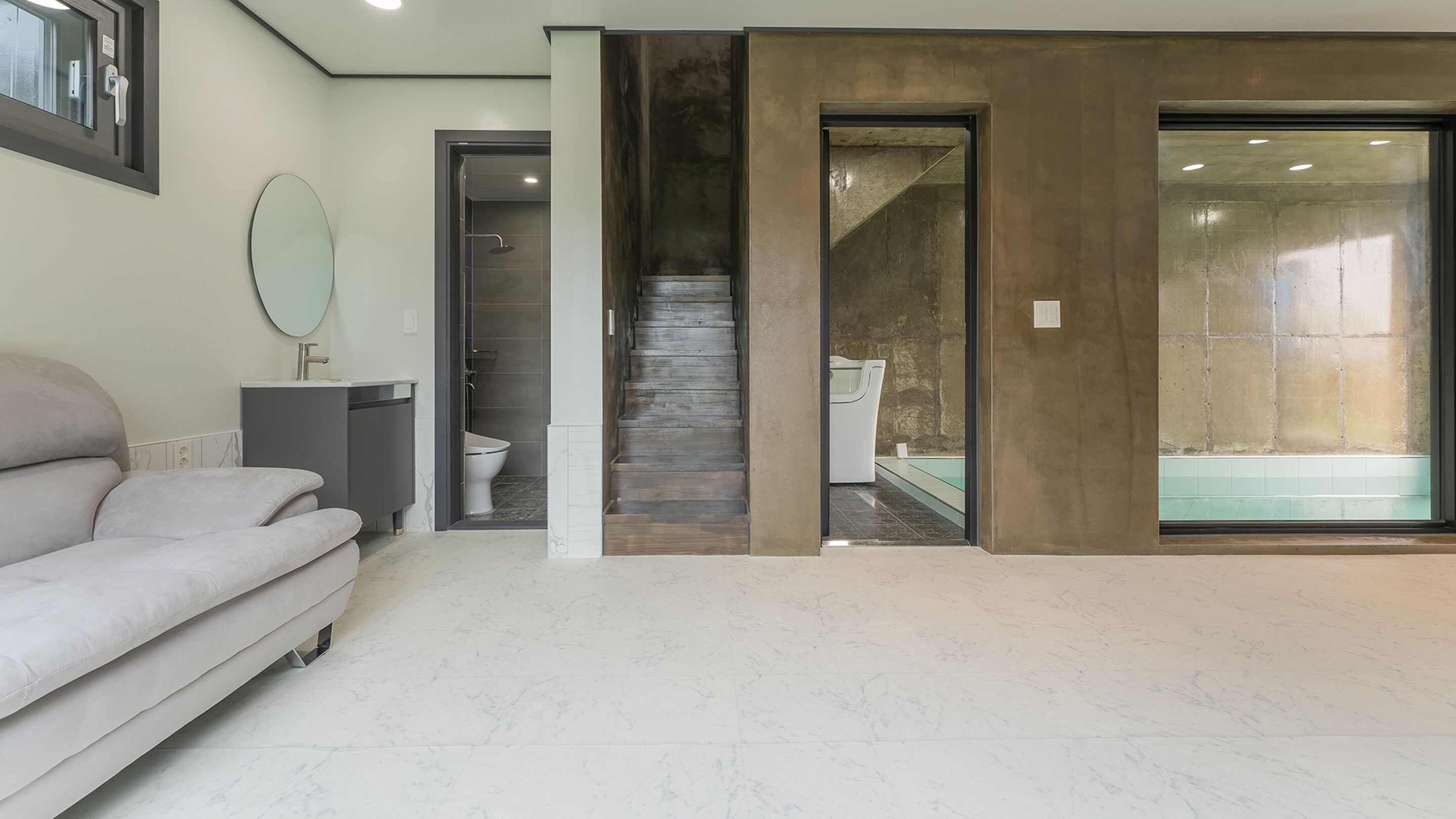 A modern bathroom with a shower, toilet, and bathtub.