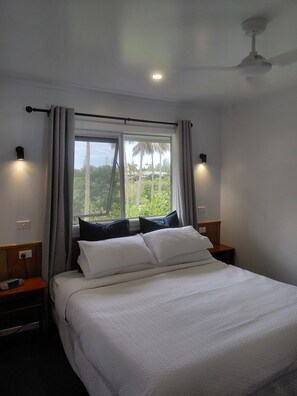 Standard Apartment | Blackout drapes, iron/ironing board, free WiFi, bed sheets