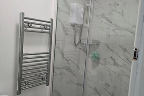 Shower, hair dryer, towels