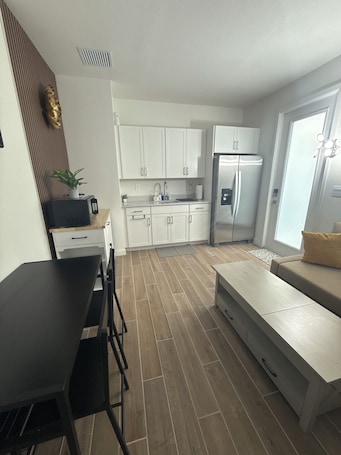 Living area. Cozy Apartment/Efficiency in tranquil Homestead with AC, WiFi, private entrance