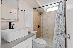 Shower, hair dryer, towels, soap