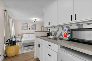 Fridge, microwave, stovetop, coffee/tea maker