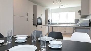 Quarto solteiro, para não fumantes | Cozinha compartilhada