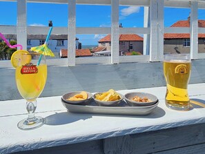 Outdoor dining - Spacious, stylish coastal duplex with sea-view decking and balcony. (Heysham near Morecambe)