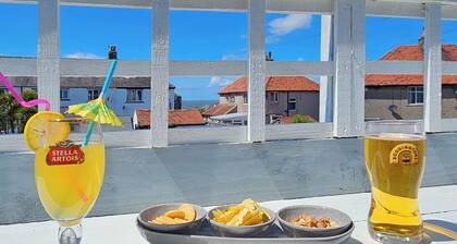 Spacious, stylish coastal duplex with sea-view decking and balcony.