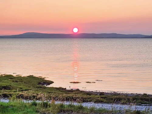 Spacious, stylish coastal duplex with sea-view decking and balcony.