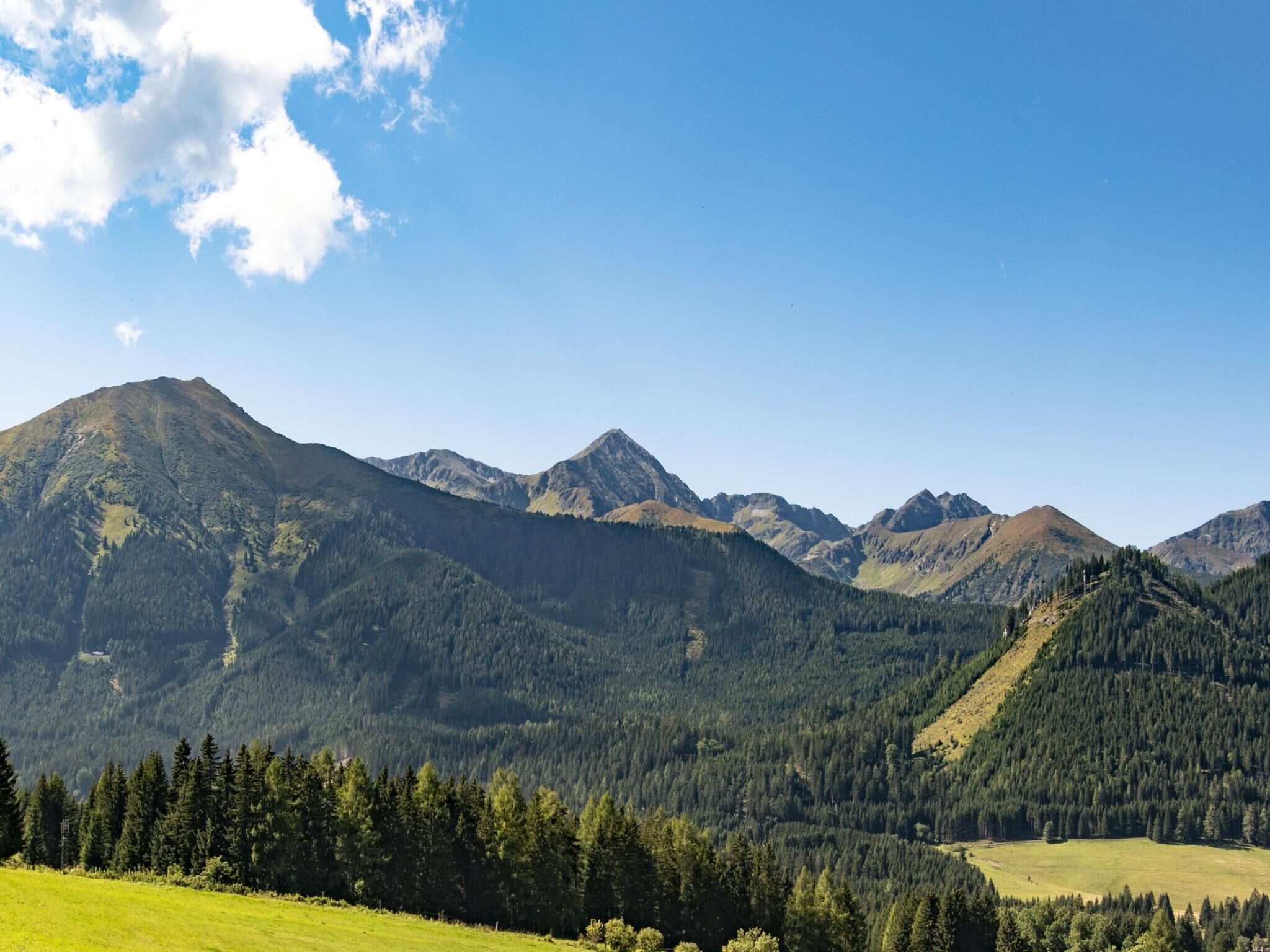 A mountain landscape with a clear sky.