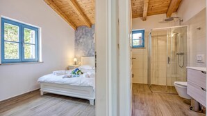 A bedroom with a bed, a nightstand, a window, and a view of the outdoors. - Villa Milo Mali Vareski With Pool (Marcana)