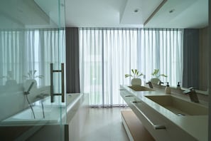 Grand Suite, Ocean View | Bathroom | Shower, hair dryer, slippers, towels