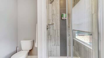 Shower, hair dryer, towels, shampoo