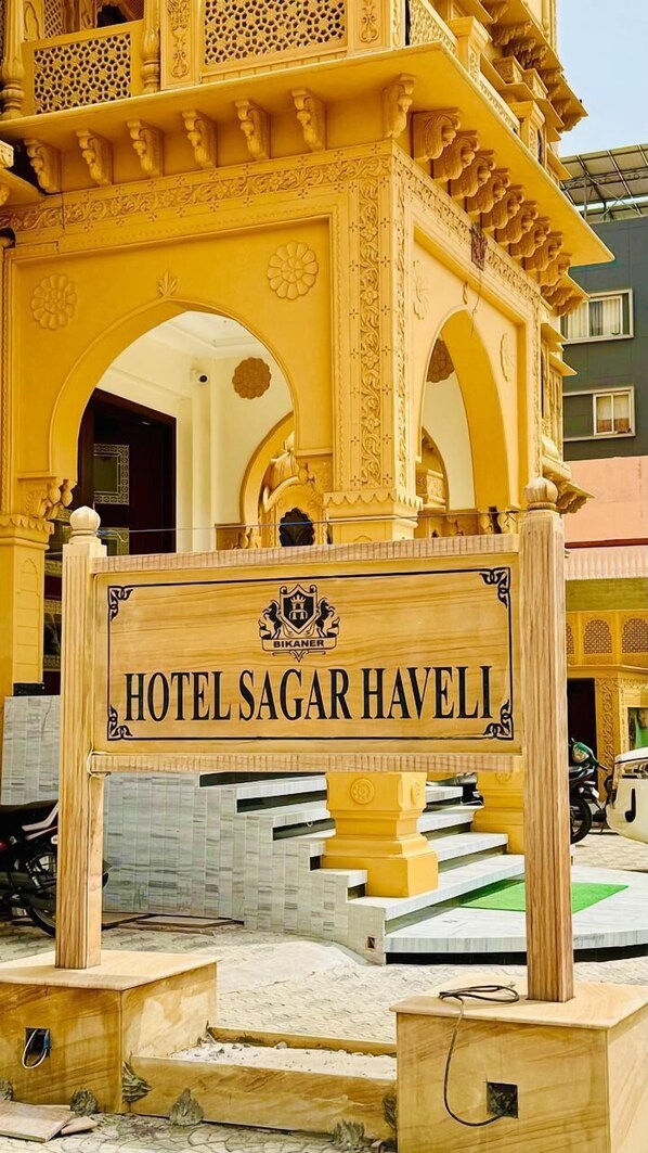A sign for Hotel Sagar Haveli with traditional architectural elements. - Hotel Sagar Haveli Bikaner (Bikaner)