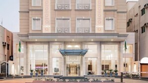 A multi-story hotel with a symmetrical facade, large windows, and a central entrance with a canopy. - Landmark Hotels & Suites (Jeddah)