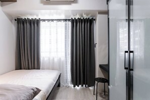 Standard Room, 1 Bedroom | Iron/ironing board, free WiFi - Air Residences (Makati)