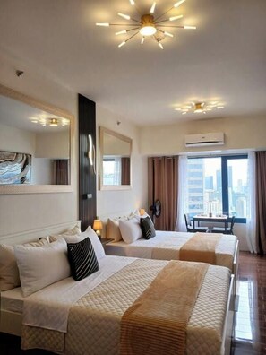 Standard Room, 1 Bedroom | Iron/ironing board, free WiFi - Air Residences (Makati)