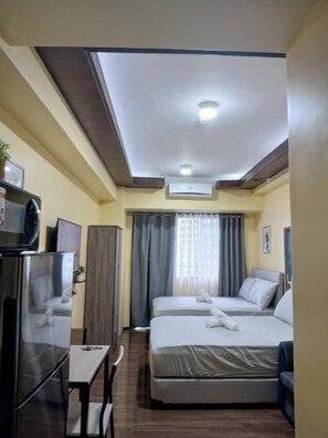 Standard Room, 1 Bedroom, Pool View | Iron/ironing board, free WiFi - Air Residences (Makati)