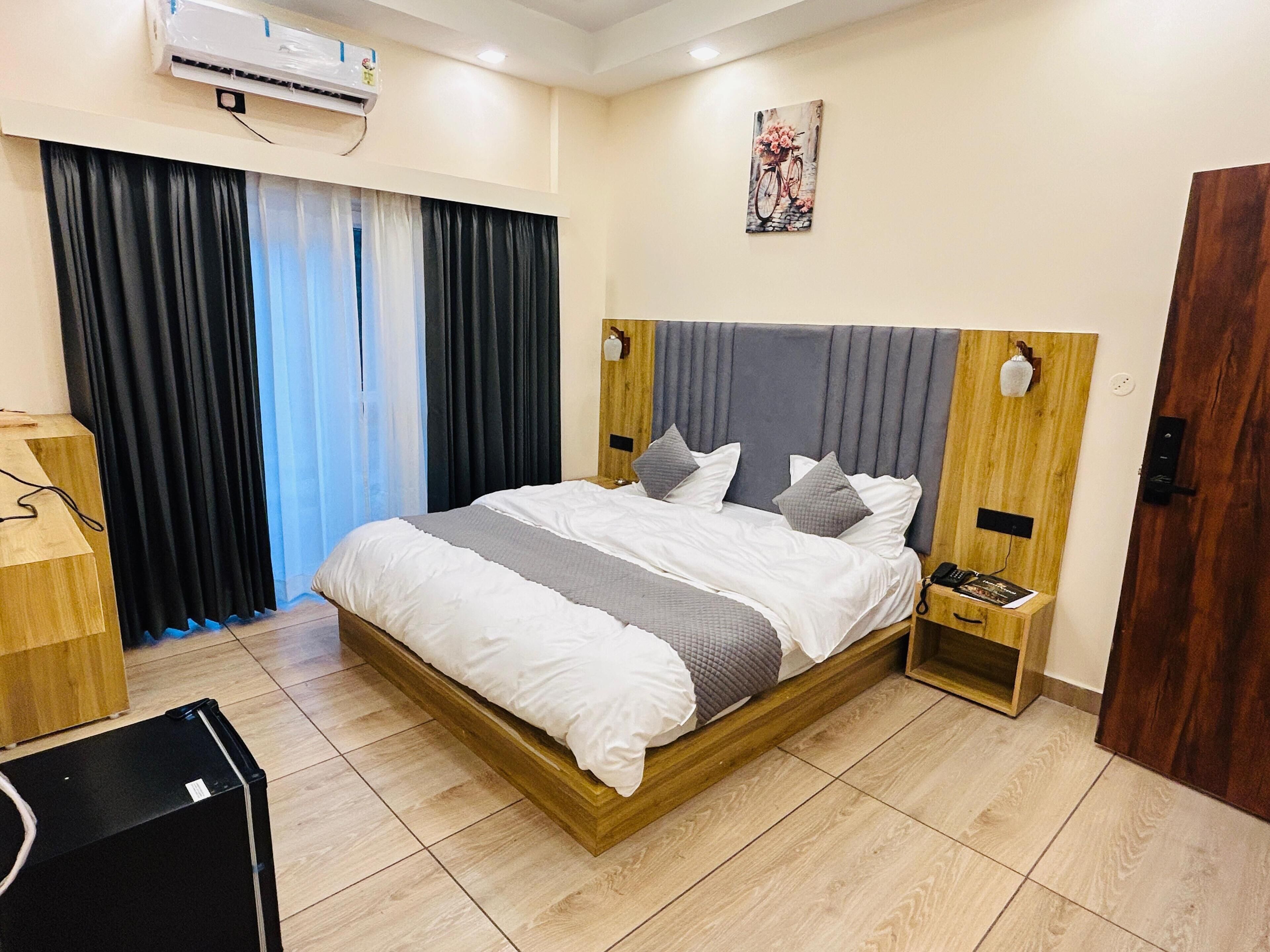 Deluxe Tek Büyük veya İki Ayrı Yataklı Oda | Ücretsiz kablosuz İnternet, çarşaf takımı 