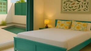 A bedroom with a bed, a nightstand, a lamp, a painting, and a small pool. - Tiger Safari Lodge (Ashta)