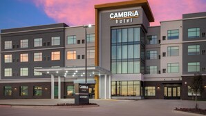 A modern hotel building with a prominent sign for 'Cambria Hotel'. - Cambria Hotel Northlake Conference Center - Roanoke (Northlake)