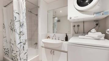 Shower, hair dryer, towels, shampoo