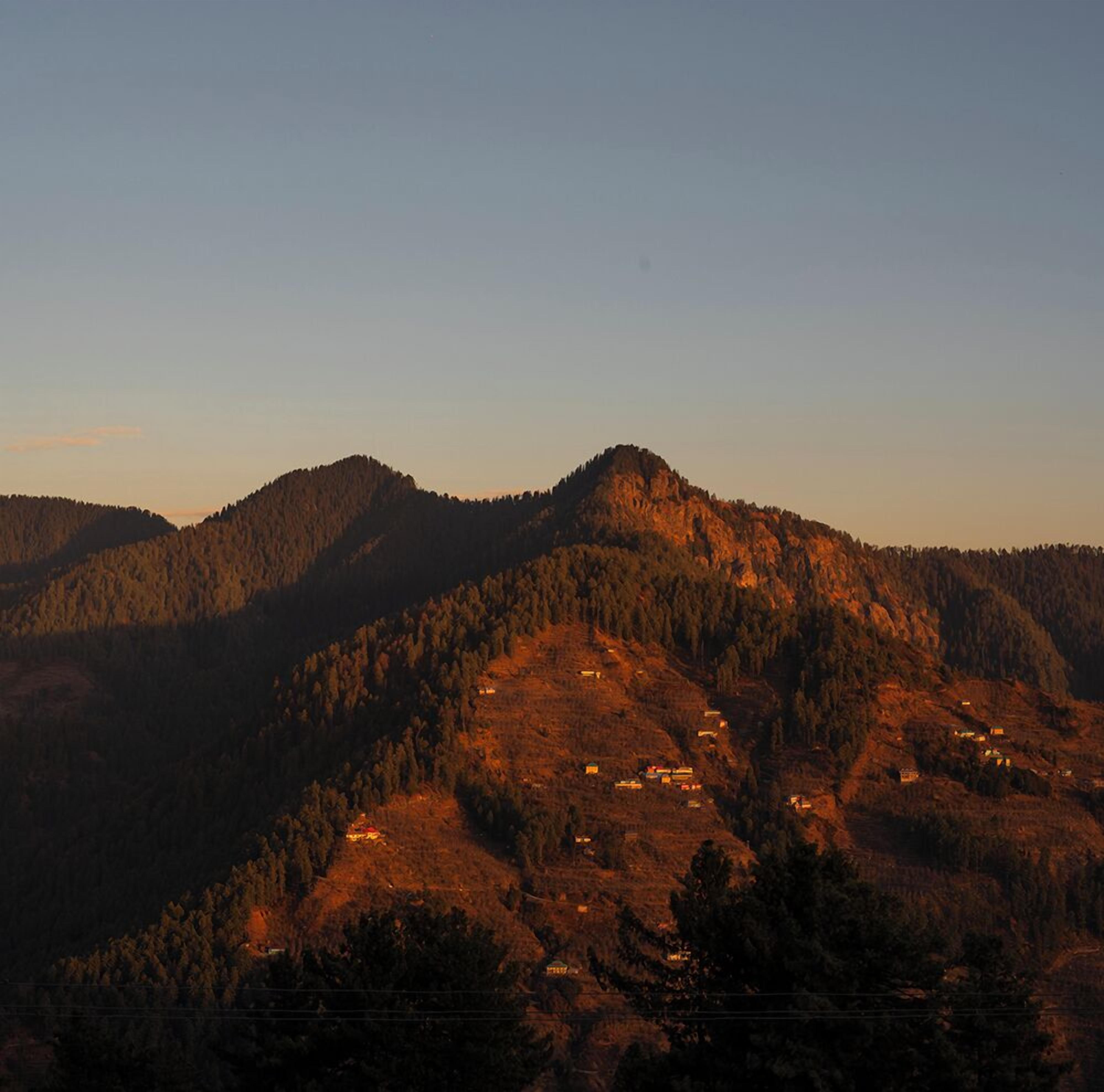A mountainous landscape with a clear sky.