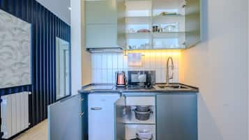 Fridge, microwave, stovetop, cookware/dishes/utensils