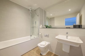 Shower, hair dryer, towels, shampoo