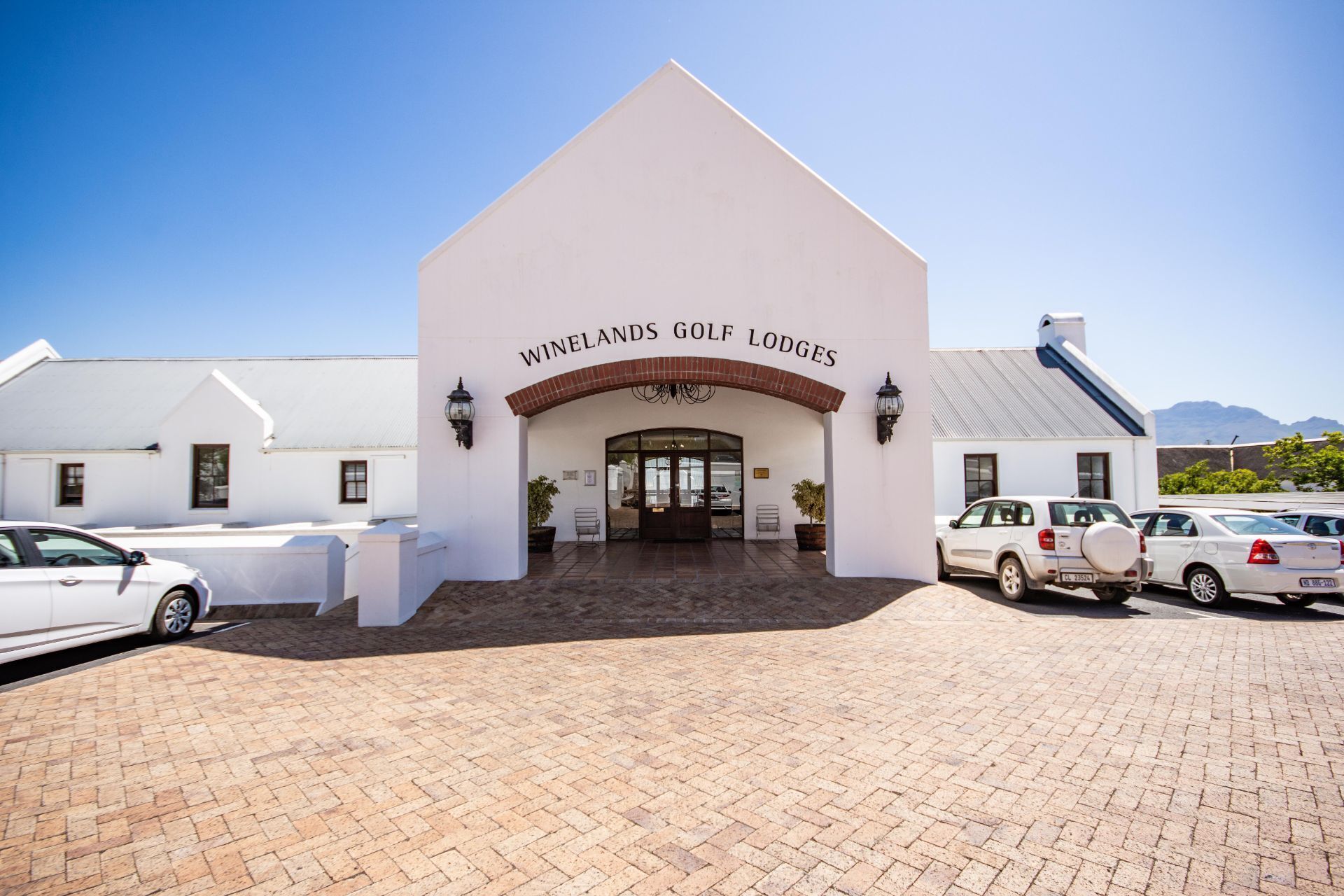 A building with a sign reading "Winelands Golf Lodges."