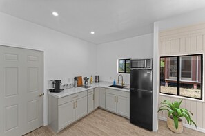 Fridge, microwave, stovetop, coffee/tea maker